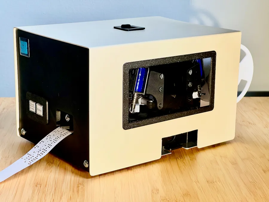 Click to view full size - The punch in it's period-appropriate off-white case and smoked acrylic window